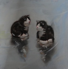 Still life oil painting of a ceramic crest set in the shape of black and white cats 